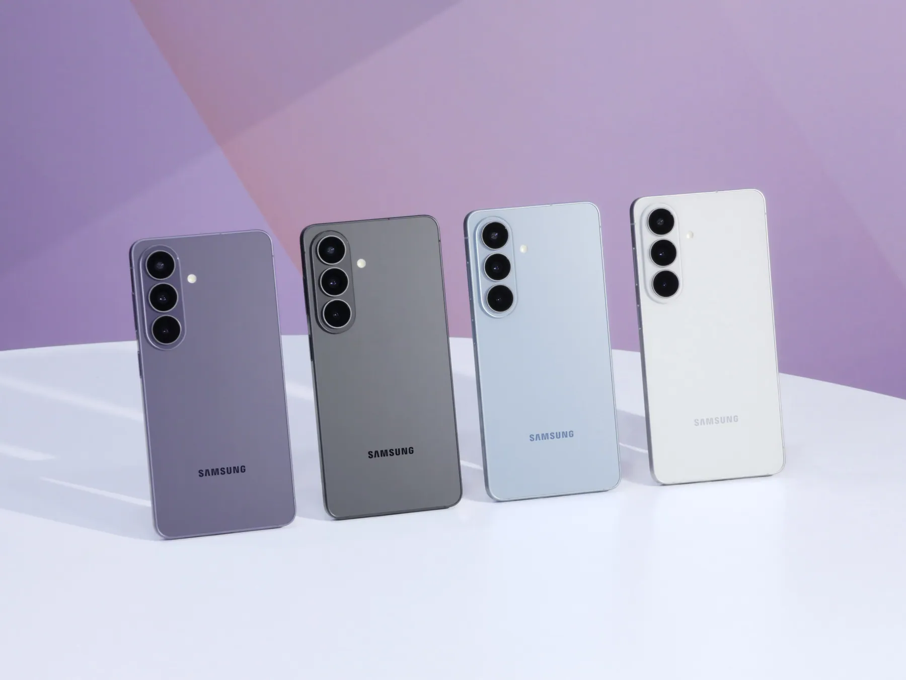Galaxy S26 series phones in Cobalt Violet, Black, Sky Blue and White standing in a row