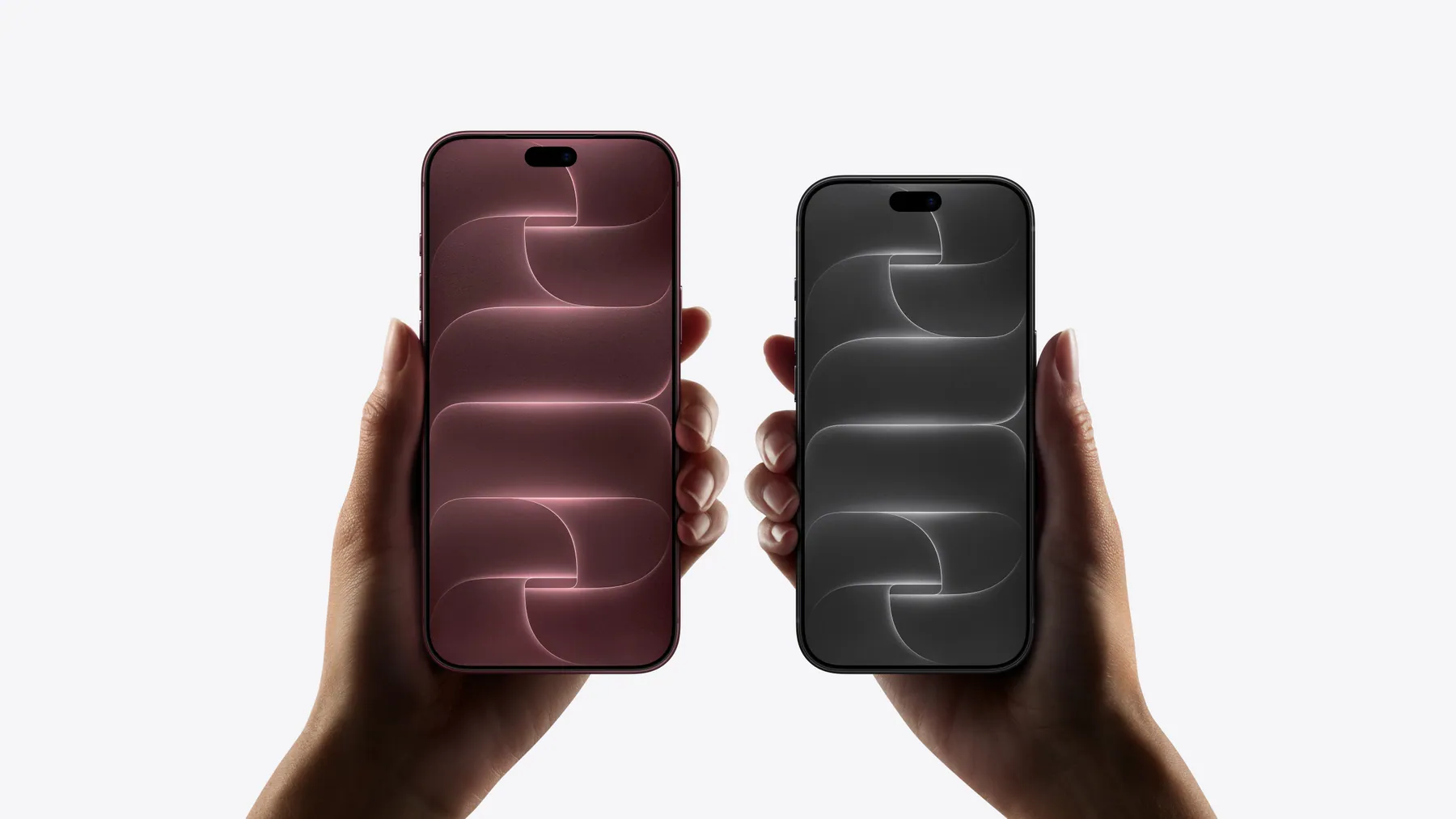 iPhone 18 Pro Max (Burgundy) and iPhone 18 Pro (Black) held side by side to compare size