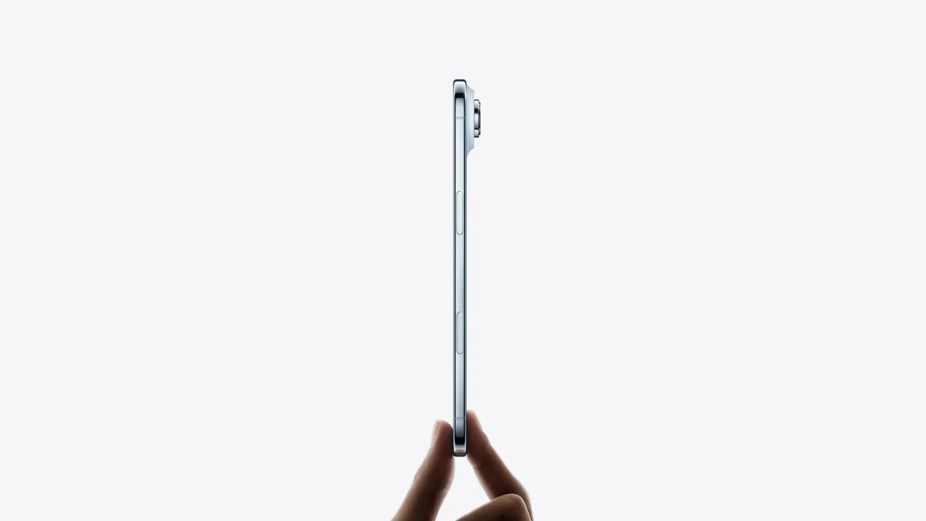 iPhone Air held by its edge, showing the ultra-thin titanium side profile