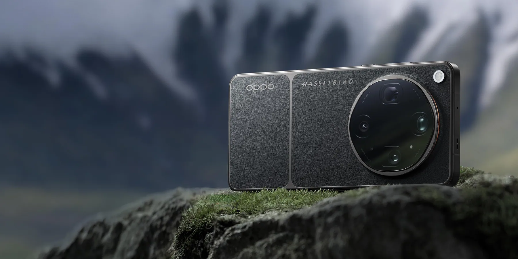 OPPO Find X9 Ultra in Tundra Umber resting on a mossy rock with mountains behind